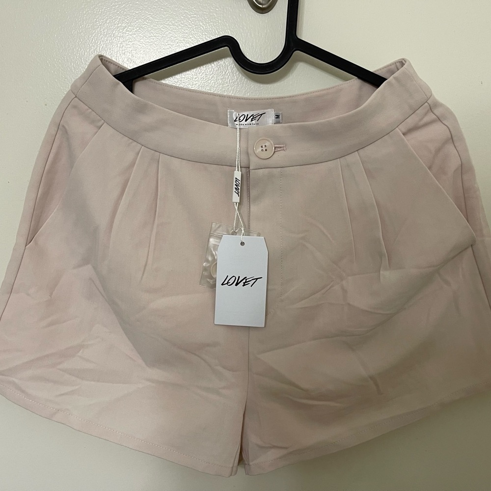 NWT LOVET Luka Flare Slant Hem Shorts. Size M